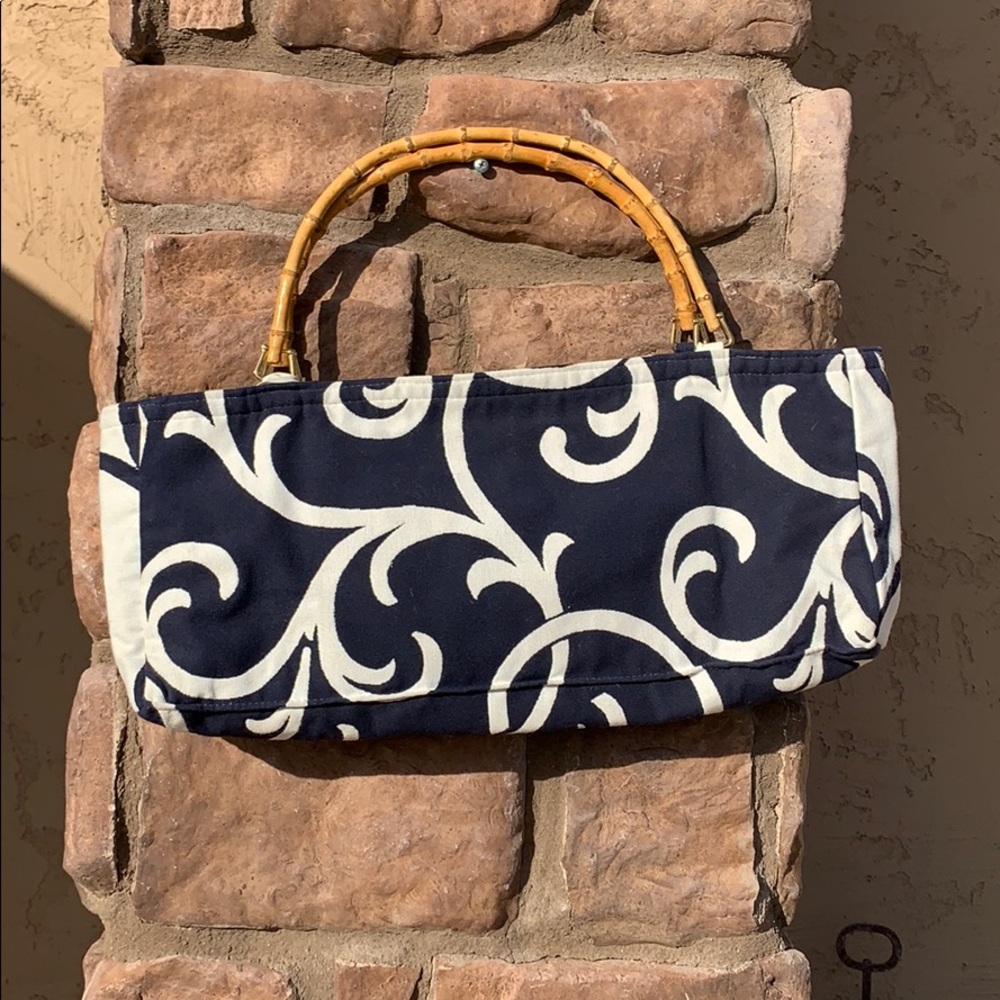 Bag with bamboo handles. 20 wide 9 tall 3 deep